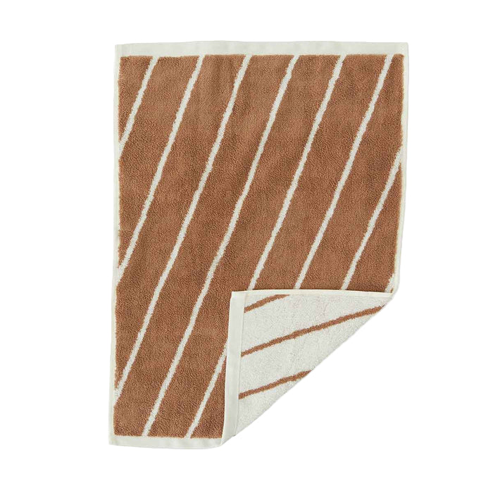 Towel with brown and white striped pattern on a white background